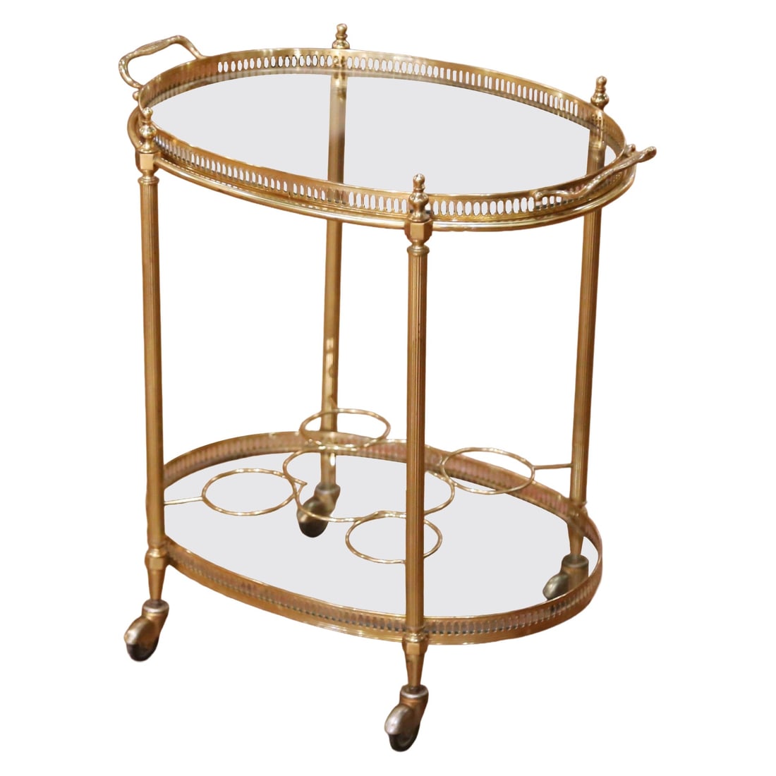French Brass Oval Bar Cart with Glass Shelves and Removable Serving Tray: French Brass Oval Bar Cart with Glass Shelves and Removable Serving Tray This mid-century French bar cart features a refined oval design crafted from brass and clear glass, echoing neoclassical influe