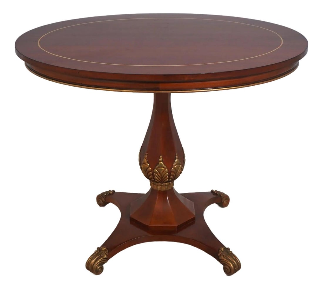 Regency Style Cherry Center Table with Oval Top and Brass Capped Feet: Regency Style Cherry Center Table with Oval Top and Brass Capped Feet This Regency style oval center table by John Widdicomb features high quality cherry wood construction with a traditional design. T