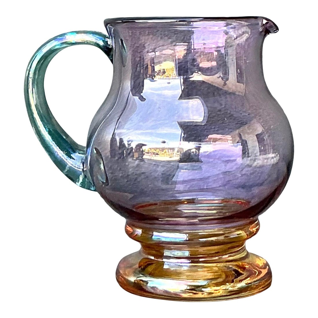 Hand-Blown Art Glass Pitcher with Amethyst Body and Amber Base: Hand-Blown Art Glass Pitcher with Amethyst Body and Amber Base This vintage hand-blown art glass pitcher features a pale amethyst purple body, a glowing amber yellow foot, and a contrasting applied te
