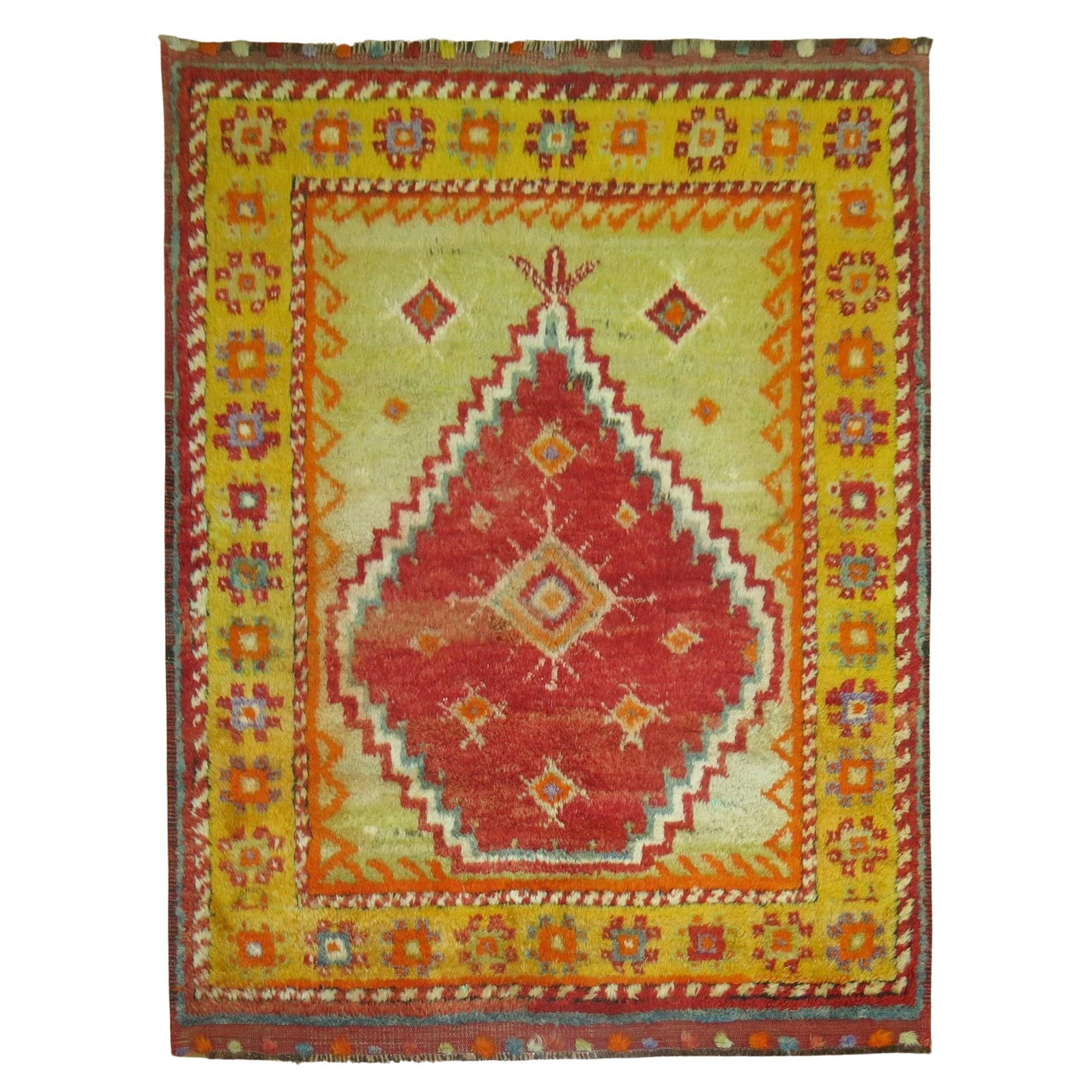 48 x 57 Inch Turkish Angora Hand-Knotted Tulu Rug Circa 1940: 48 x 57 Inch Turkish Angora Hand-Knotted Tulu Rug Circa 1940 This vibrant Vintage Turkish Tulu Square Carpet features a striking combination of saturated red, lime green, and orange tones. Hand-knotte