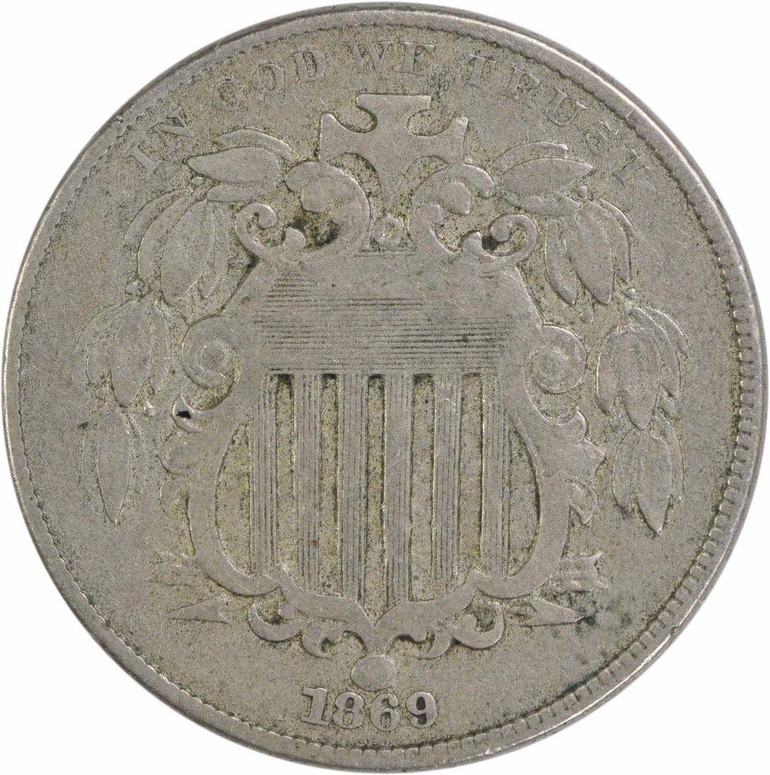 1869 Shield Nickel VF Uncertified 5C Philadelphia Mint: 1869 Shield Nickel VF Uncertified 5C Philadelphia Mint This 1869 Shield Nickel, featuring a design by James Barton Longacre, is a noteworthy piece of American numismatic history. The coin, which is ci