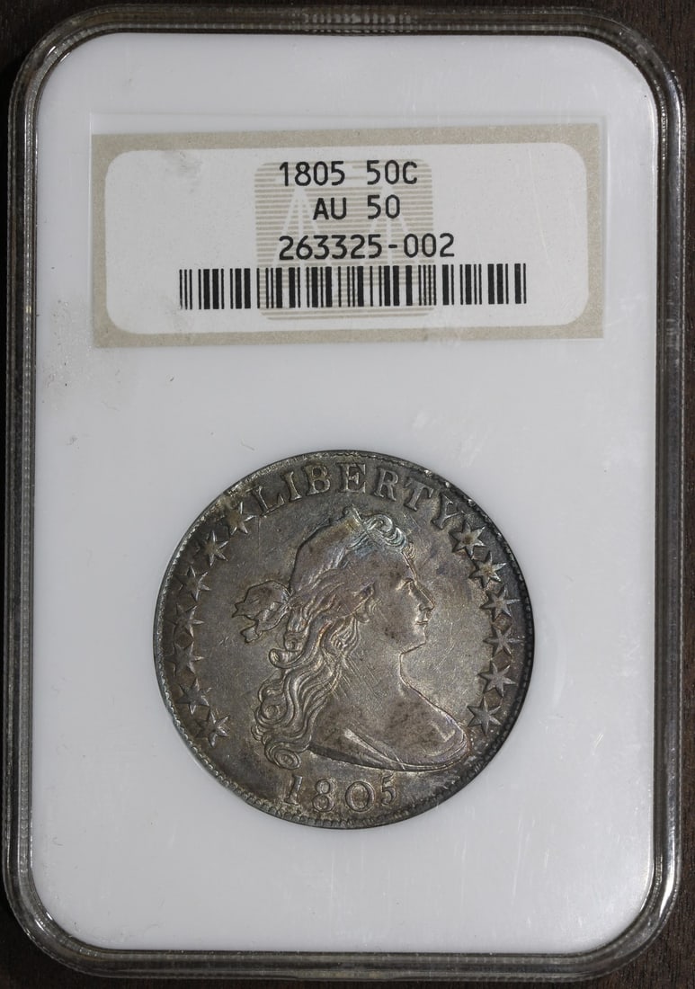 NGC AU50 1805 Draped Bust Silver Half Dollar with Attractive Toning: NGC AU50 1805 Draped Bust Silver Half Dollar with Attractive Toning This 1805 Draped Bust Half Dollar features a nice tone and is graded AU50 by NGC. The coin is composed of silver with a fineness of 