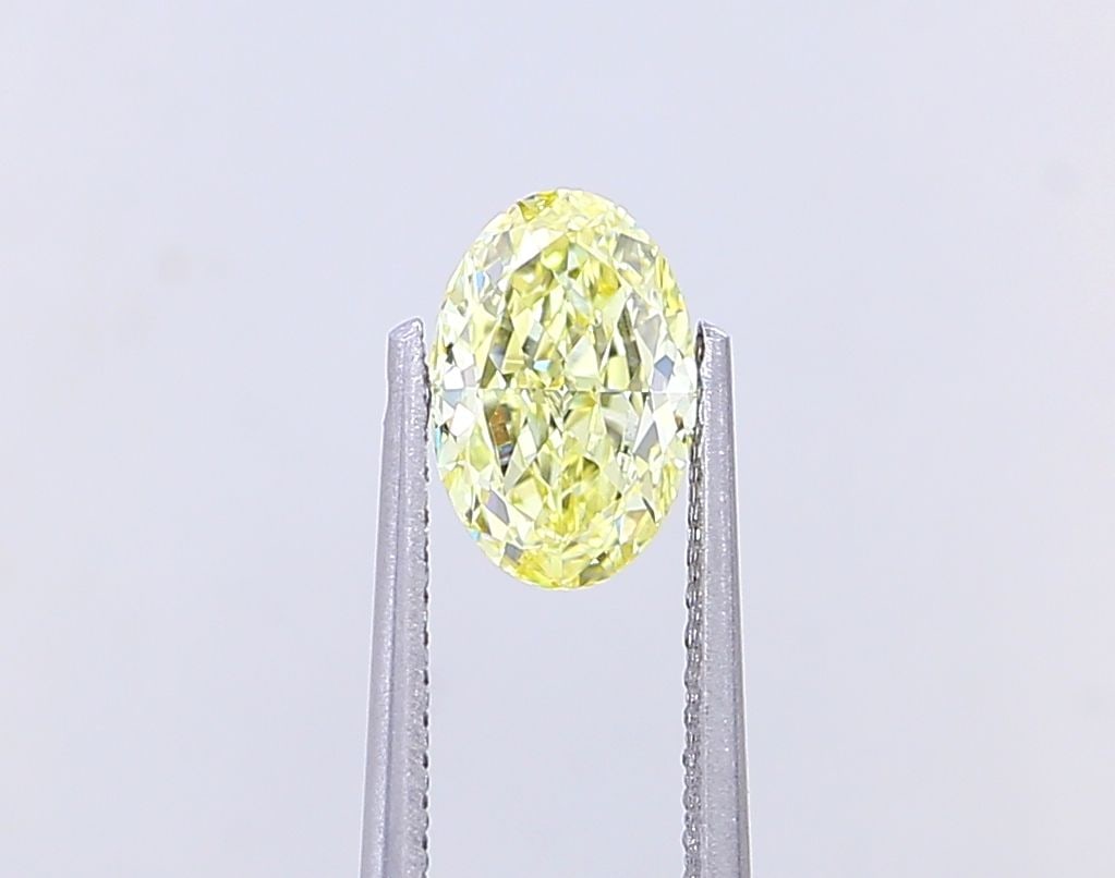 Loose Diamond - OVAL 1.07ct Fancy Yellow VVS2: Loose Diamond - OVAL 1.07ct Fancy Yellow VVS2 Source: This is a real non-mined Diamond that has been grown in a lab Shape: OVAL Carats: 1.07 Color: Fancy Yellow Certification: IGI Video: