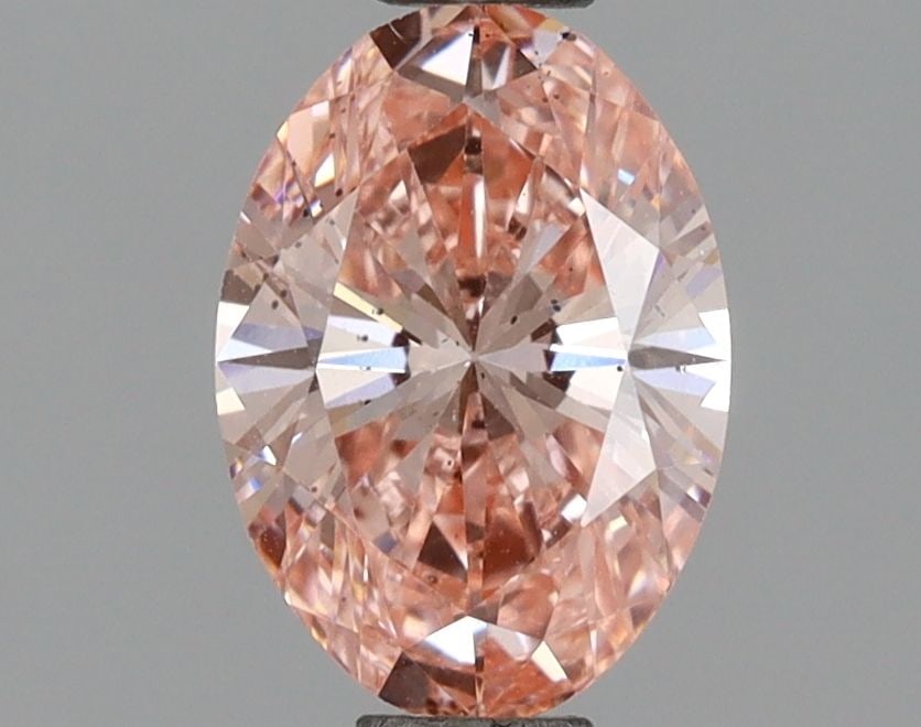 Loose Diamond - OVAL 1.0ct Fancy Vivid Pink SI1: Loose Diamond - OVAL 1.0ct Fancy Vivid Pink SI1 Source: This is a real non-mined Diamond that has been grown in a lab Shape: OVAL Carats: 1.0 Color: Fancy Vivid Pink Certification: IGI Video: