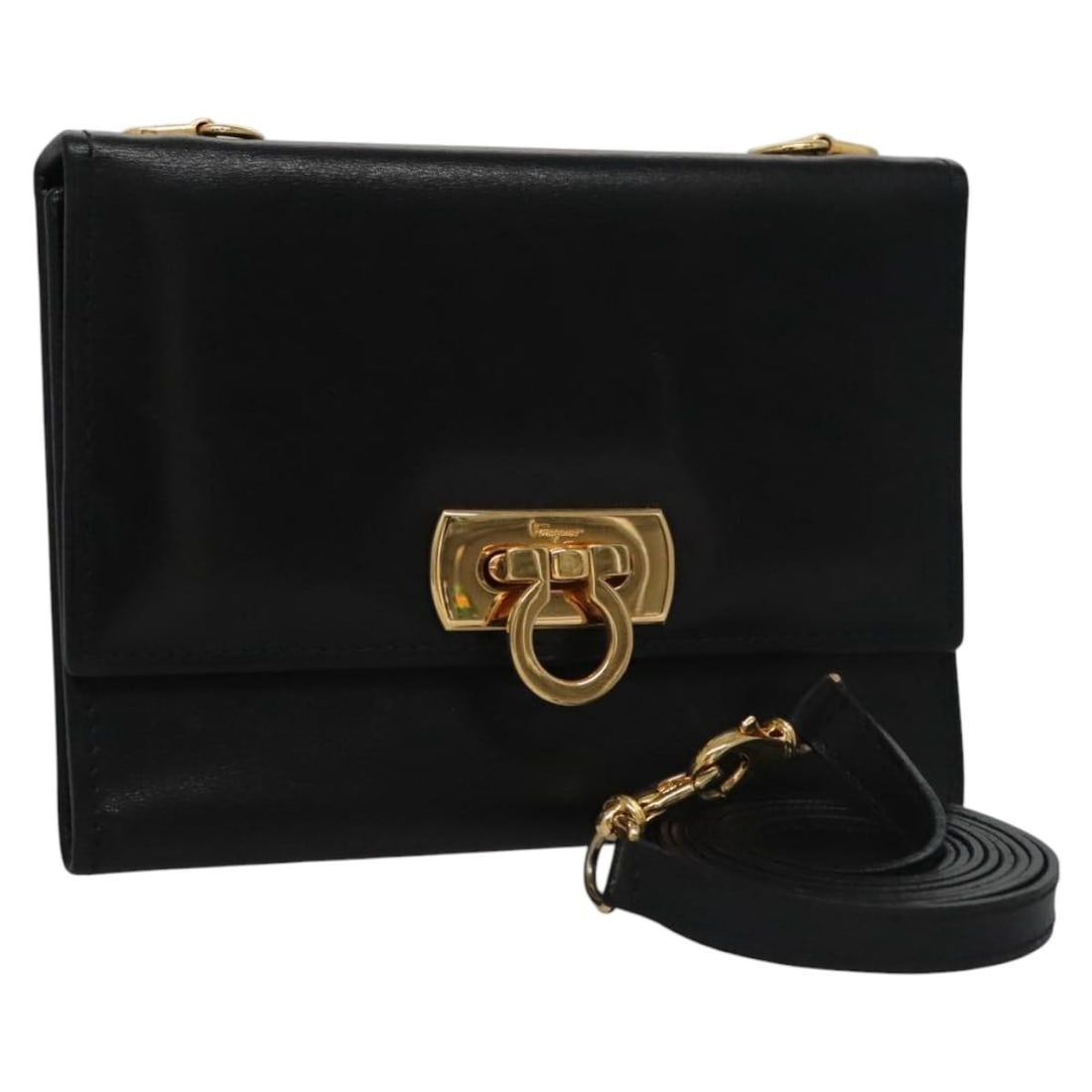 Leather Gancini Flap Wallet by Salvatore Ferragamo for Women: Leather Gancini Flap Wallet by Salvatore Ferragamo for Women This black leather Gancini flap wallet from Salvatore Ferragamo is designed for women. Crafted in Italy, it features a compact size suitabl