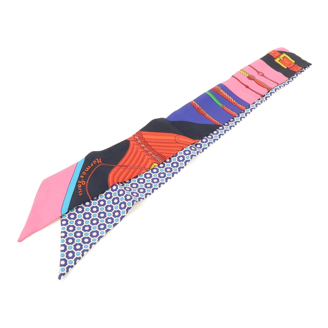 Silk Twilly Scarf by HERMES in Purple and Pink: Silk Twilly Scarf by HERMES in Purple and Pink This Hermes Twilly scarf features a vibrant purple and pink color scheme crafted in luxurious silk. Designed for women, it offers a versatile accessory t