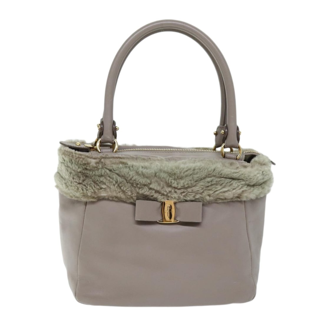Pink Vala Leather Handbag by Salvatore Ferragamo: Pink Vala Leather Handbag by Salvatore Ferragamo This Salvatore Ferragamo Vala bag is crafted from pink leather and designed for women. It features a structured silhouette with dimensions of 23cm x 20