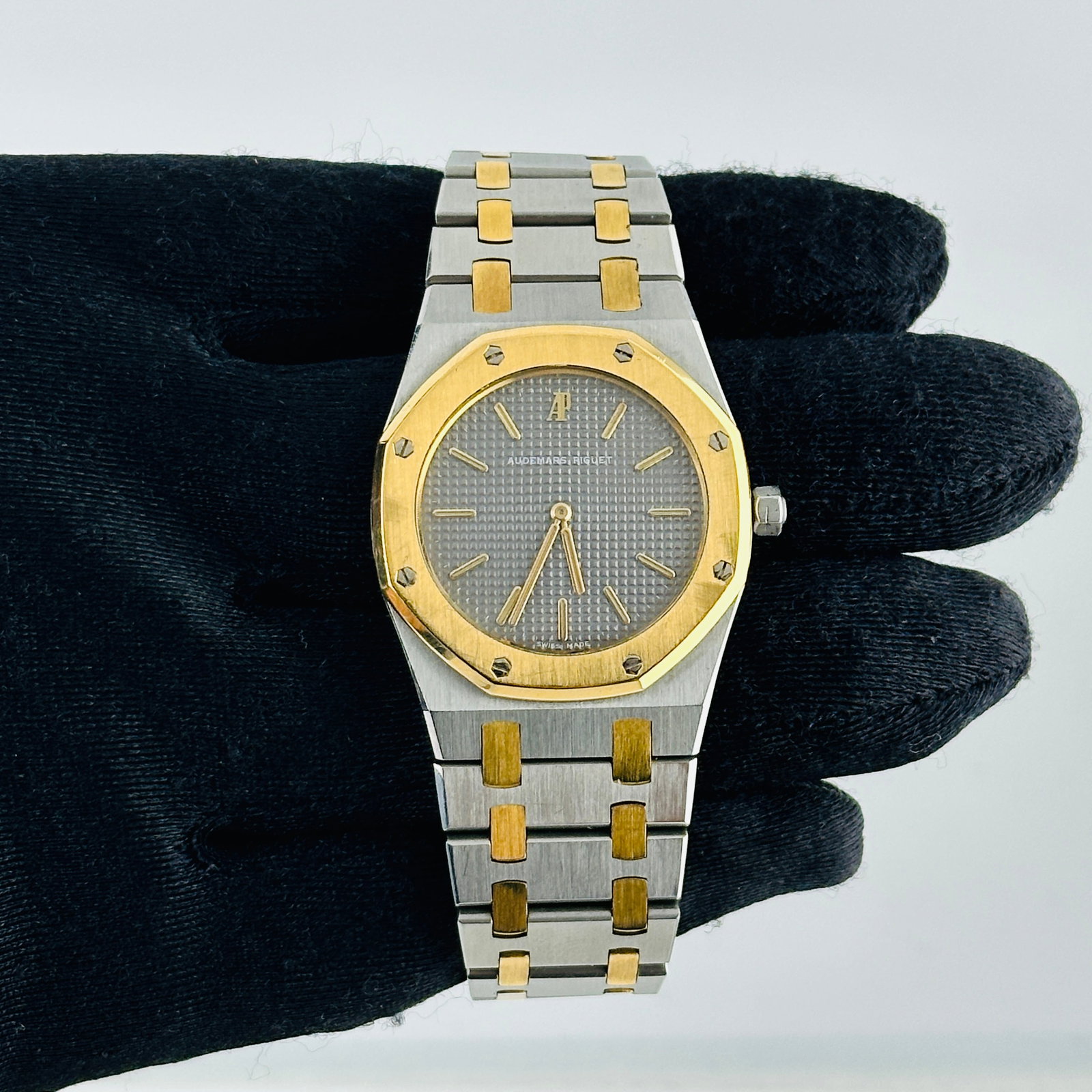 Royal Oak 56143SA 33mm Watch Gray Dial Two Tone Bracelet: Royal Oak 56143SA 33mm Watch Gray Dial Two Tone Bracelet This Audemars Piguet Royal Oak features a gray dial and a fixed bezel, complemented by a two-tone bracelet. Designed as a unisex timepiece, it 
