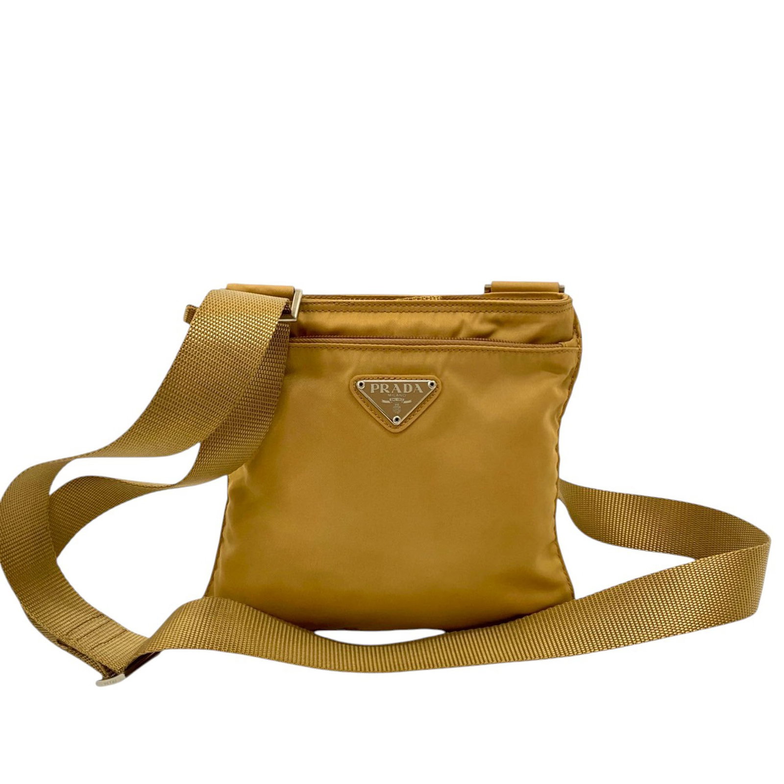 Prada Tessuto Nylon Beige Crossbody Bag with Adjustable Strap: Prada Tessuto Nylon Beige Crossbody Bag with Adjustable Strap This Prada Tessuto Zip Top Crossbody features a beige nylon body with a flat adjustable strap, a top zip closure, and an exterior front zi