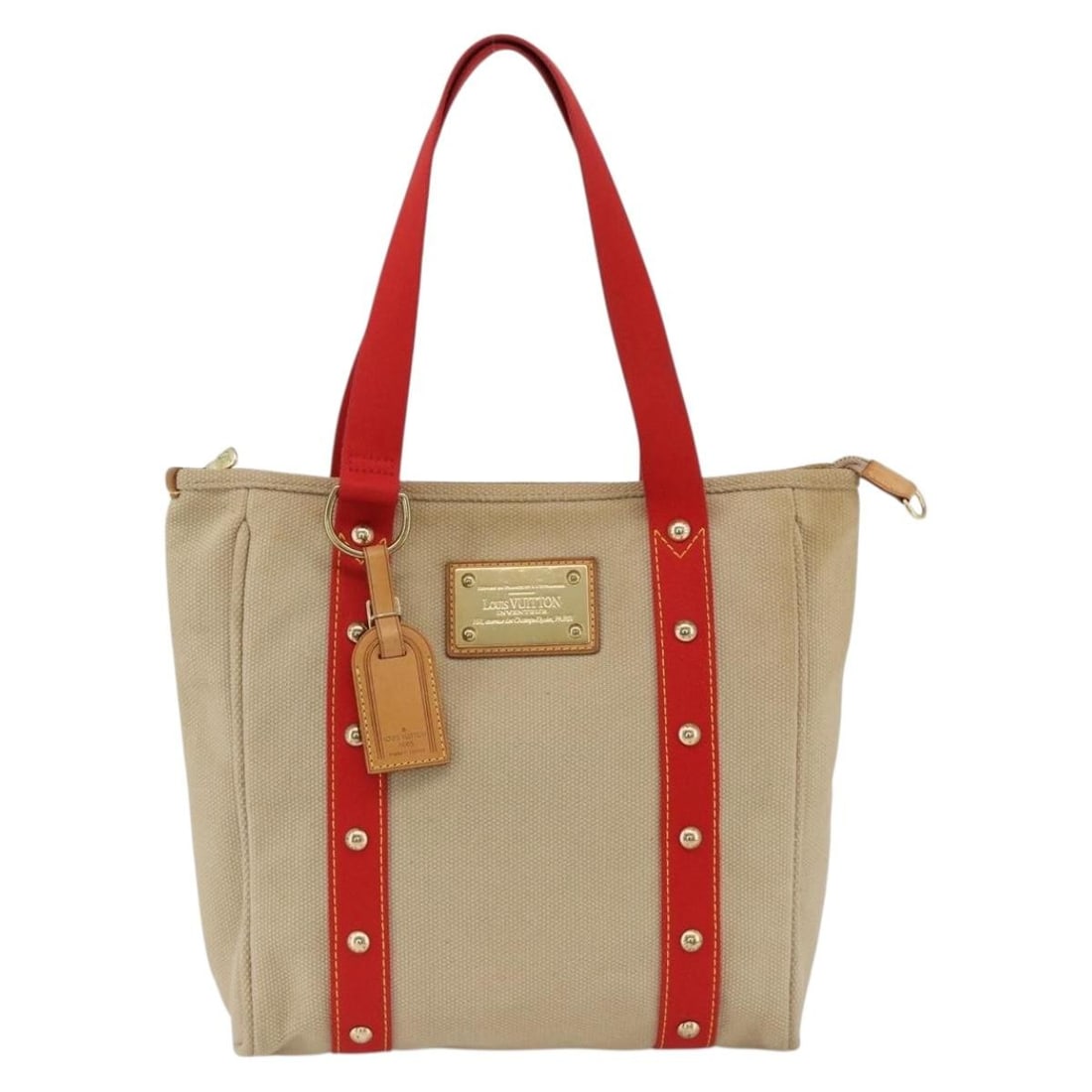 Louis Vuitton Antigua Beige Canvas Tote Bag 29cm x 30cm x 9.5cm: Louis Vuitton Antigua Beige Canvas Tote Bag 29cm x 30cm x 9.5cm This Louis Vuitton Antigua Tote is crafted from beige canvas and designed for women. The tote features leather handles and metal fitting