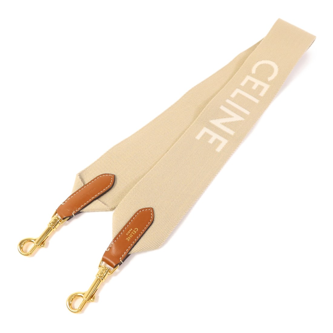 Celine Beige Canvas Strap with Gold Hardware Made in France: Celine Beige Canvas Strap with Gold Hardware Made in France This Celine strap is crafted from high-quality canvas in a sophisticated beige color. Designed for regular sizing, it offers both style and 