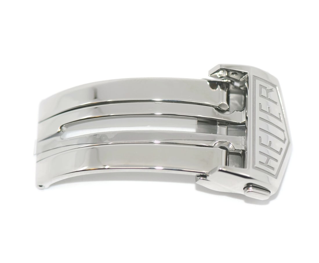 Stainless Steel Watch Clasp FC5042 18mm for Tag Heuer: Stainless Steel Watch Clasp FC5042 18mm for Tag Heuer This TAG Heuer deployment buckle is crafted from stainless steel and features an 18 mm width. Designed for wristwatch bands, it is compatible with