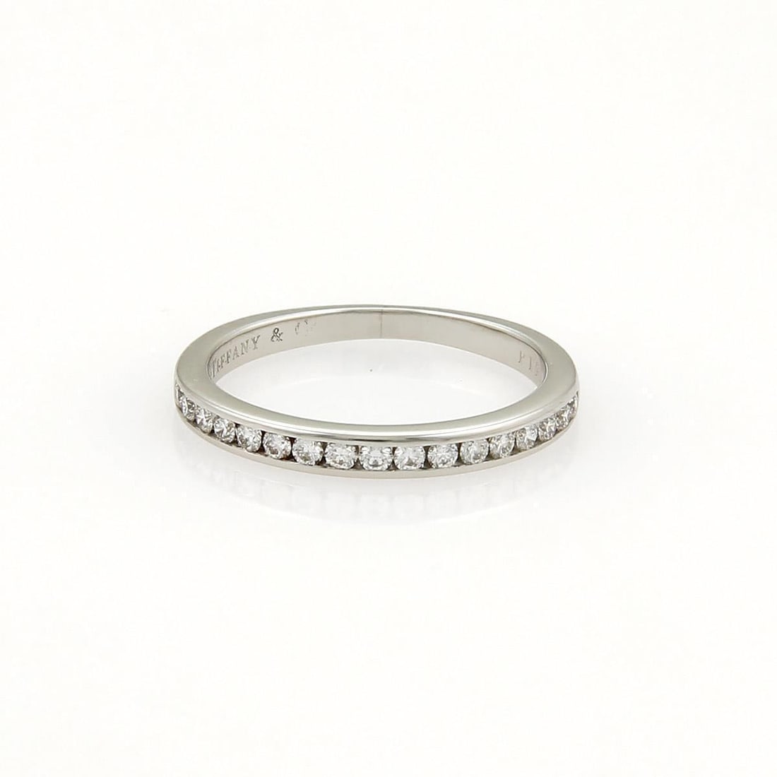 Tiffany & Co. Platinum 2mm Half Circle Diamond Band Ring Size 4: Tiffany & Co. Platinum 2mm Half Circle Diamond Band Ring Size 4 This exquisite wedding band from Tiffany & Co. is crafted from high-quality platinum, showcasing a delicate 2mm wide design. The ring fe