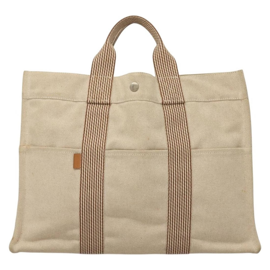 Beige Canvas Fourre Tout Tote by Hermes 42cm x 30cm x 10cm: Beige Canvas Fourre Tout Tote by Hermes 42cm x 30cm x 10cm This Hermes Fourre Tout Tote for women is crafted from beige canvas with leather trim. It features a spacious design with external and intern