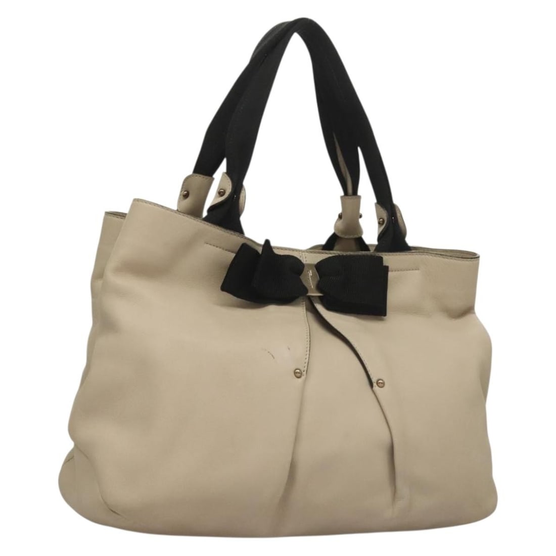 Vara Bow Tote in Beige Leather by Salvatore Ferragamo: Vara Bow Tote in Beige Leather by Salvatore Ferragamo This Salvatore Ferragamo Vara bow tote is crafted from beige leather and designed for women. Made in Italy, the bag features the signature Vara bo