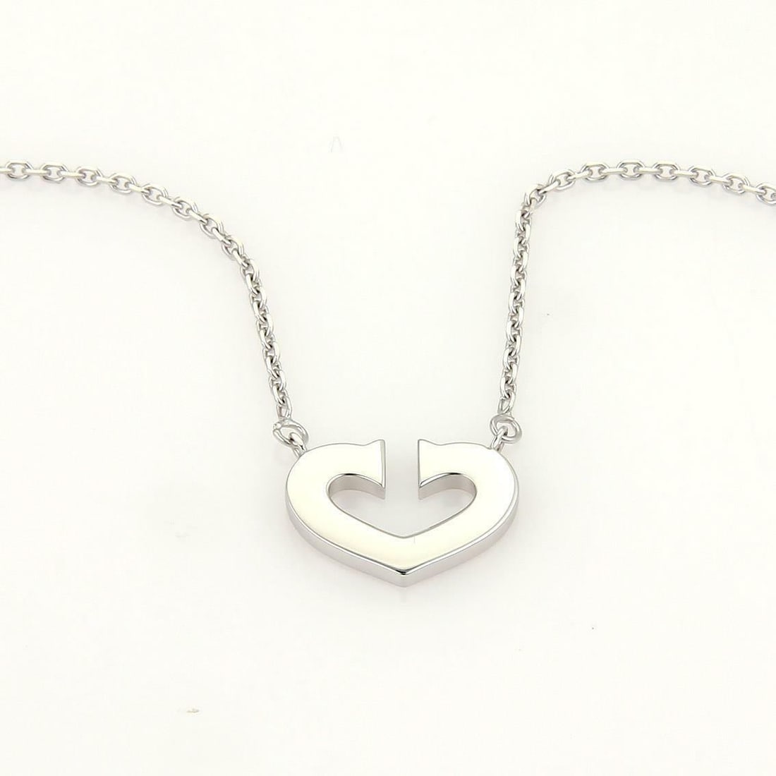 Cartier C Hearts 18k White Gold Necklace with Certificate: Cartier C Hearts 18k White Gold Necklace with Certificate Elevate your style with this stunning authentic necklace from the C Hearts of Cartier Collection. The necklace features a beautifully designed