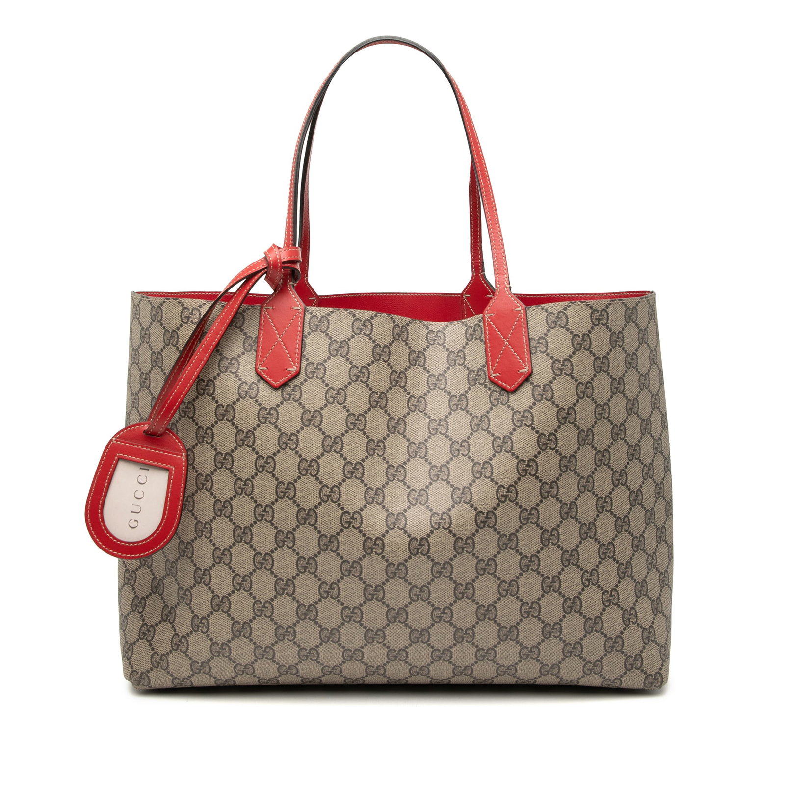 Gucci GG Supreme Medium Reversible Coated Canvas Tote Bag Beige: Gucci GG Supreme Medium Reversible Coated Canvas Tote Bag Beige This Gucci Medium GG Supreme Reversible Tote features a coated canvas body with leather trim, flat leather handles, and an open top desi