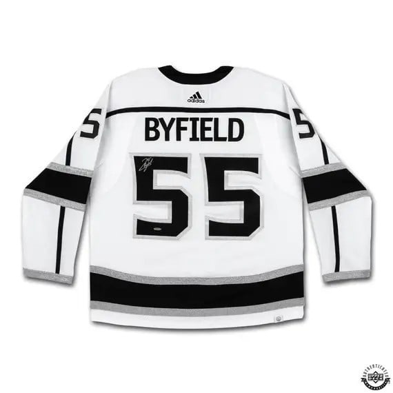 Quinton Byfield Autographed White Jersey Los Angeles Kings UDA Certified: Quinton Byfield Autographed White Jersey Los Angeles Kings UDA Certified This is an original autographed jersey of Quinton Byfield, a prominent player for the Los Angeles Kings. The jersey features th