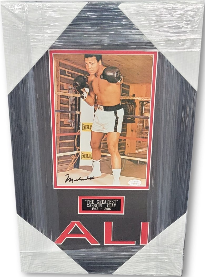 Muhammad Ali Signed Photo Custom Framed JSA Authenticated 13 x 20: Muhammad Ali Signed Photo Custom Framed JSA Authenticated 13 x 20 This stunning Muhammad Ali hand-signed photograph captures the essence of one of boxing's greatest legends. Expertly custom framed, th