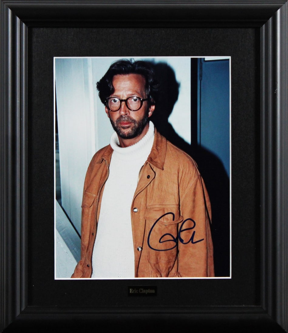 Eric Clapton Signed 8x10 Framed Photo with JSA Authentication: Eric Clapton Signed 8x10 Framed Photo with JSA Authentication This authentic 8x10 framed photograph features the signature of legendary musician Eric Clapton. The photo is professionally framed, with 