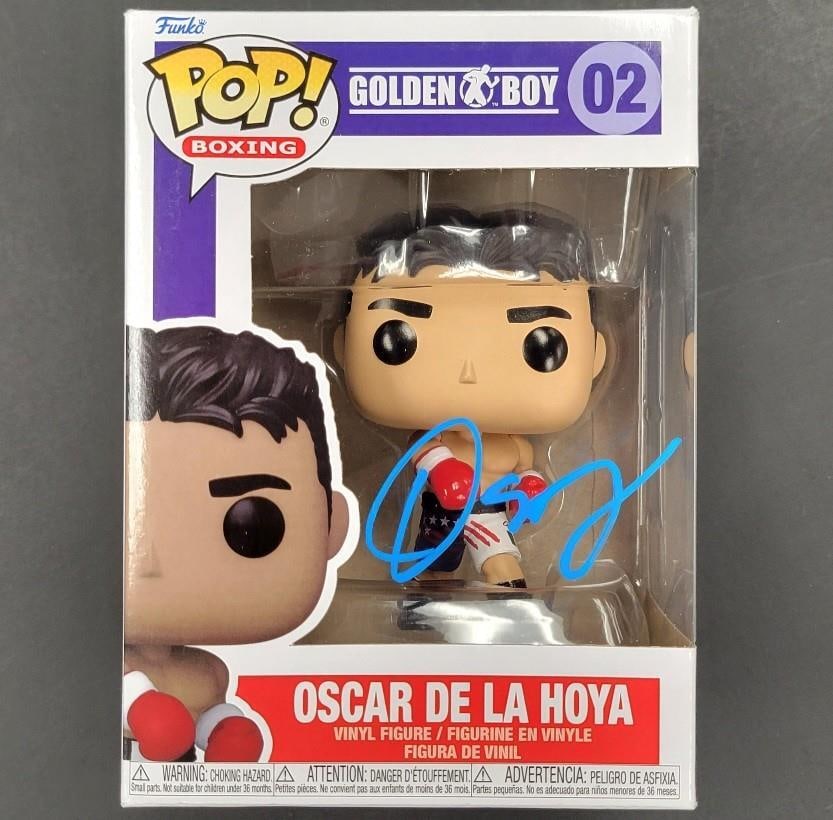 Oscar De La Hoya Golden Boy Funko Pop Signed Blue Autograph BAS: Oscar De La Hoya Golden Boy Funko Pop Signed Blue Autograph BAS This is an original Funko Pop figurine of Oscar De La Hoya, known as the 'Golden Boy.' It features a blue autograph signed by De La Hoya