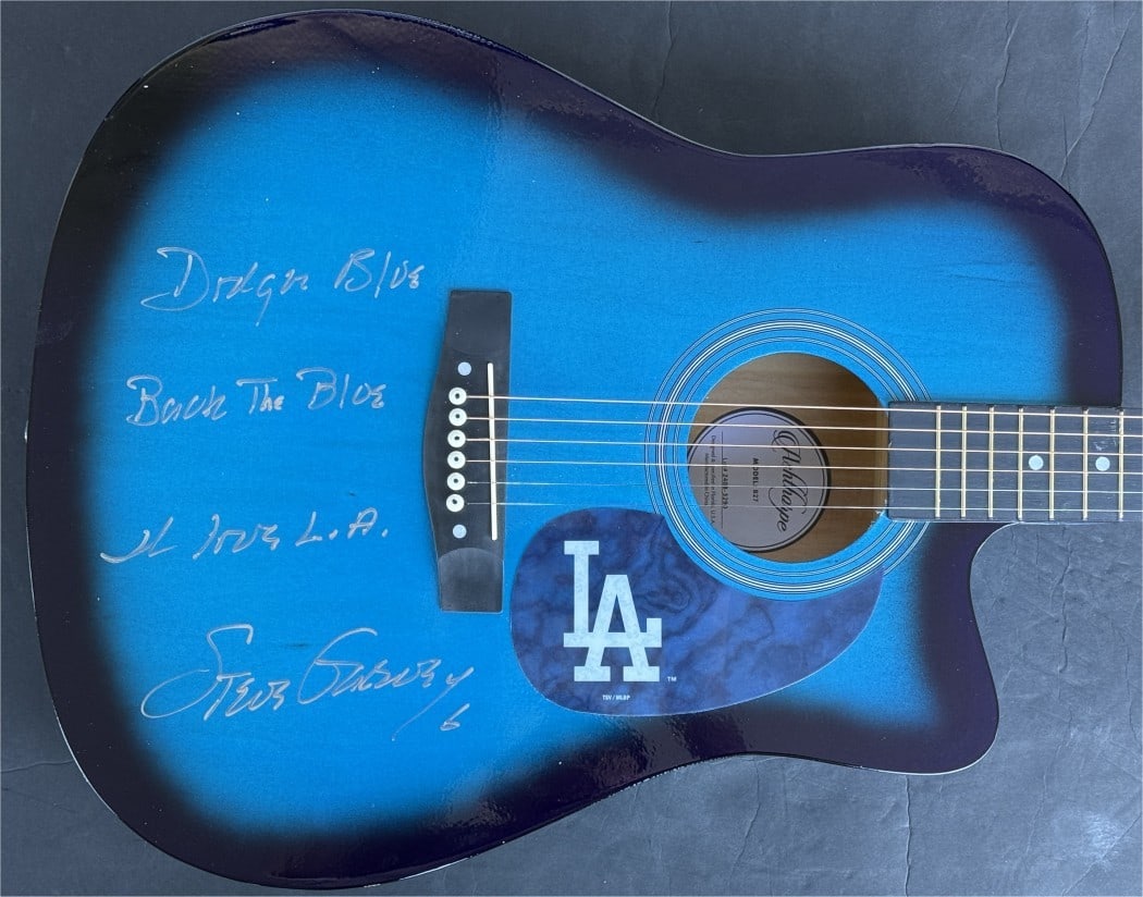 Steve Garvey Autographed Dodgers Guitar Back The Blue JSA Authenticated: Steve Garvey Autographed Dodgers Guitar Back The Blue JSA Authenticated Celebrate the legacy of baseball with this authentic Steve Garvey signed guitar, featuring a vibrant Dodgers blue design and the