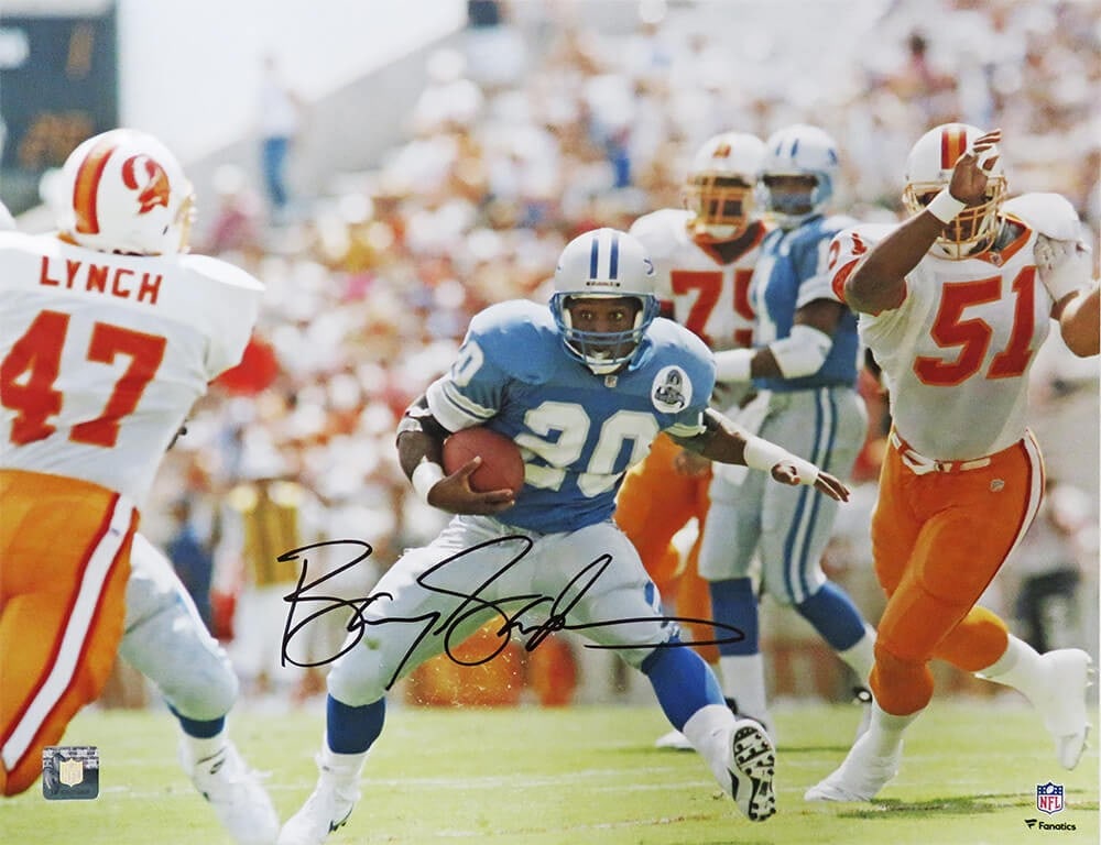Barry Sanders Signed 16x20 Lions vs Buccaneers Photo with COA: Barry Sanders Signed 16x20 Lions vs Buccaneers Photo with COA This stunning 16x20 photograph captures Barry Sanders in action against the Buccaneers, showcasing one of the NFL's greatest running backs