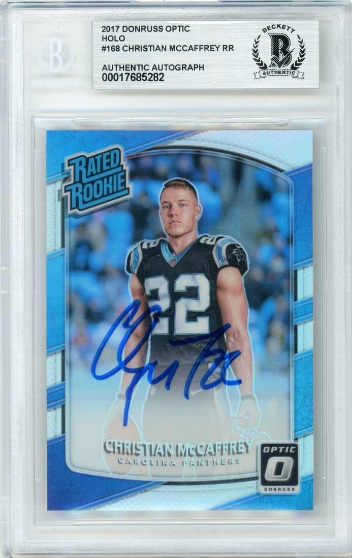 Christian McCaffrey Signed 2017 Optic Rated Rookie Holo Panthers BGS Graded Card: Christian McCaffrey Signed 2017 Optic Rated Rookie Holo Panthers BGS Graded Card This 2017 Donruss Optic Rated Rookie Holo #168 sports trading card features Christian McCaffrey of the Carolina Panther