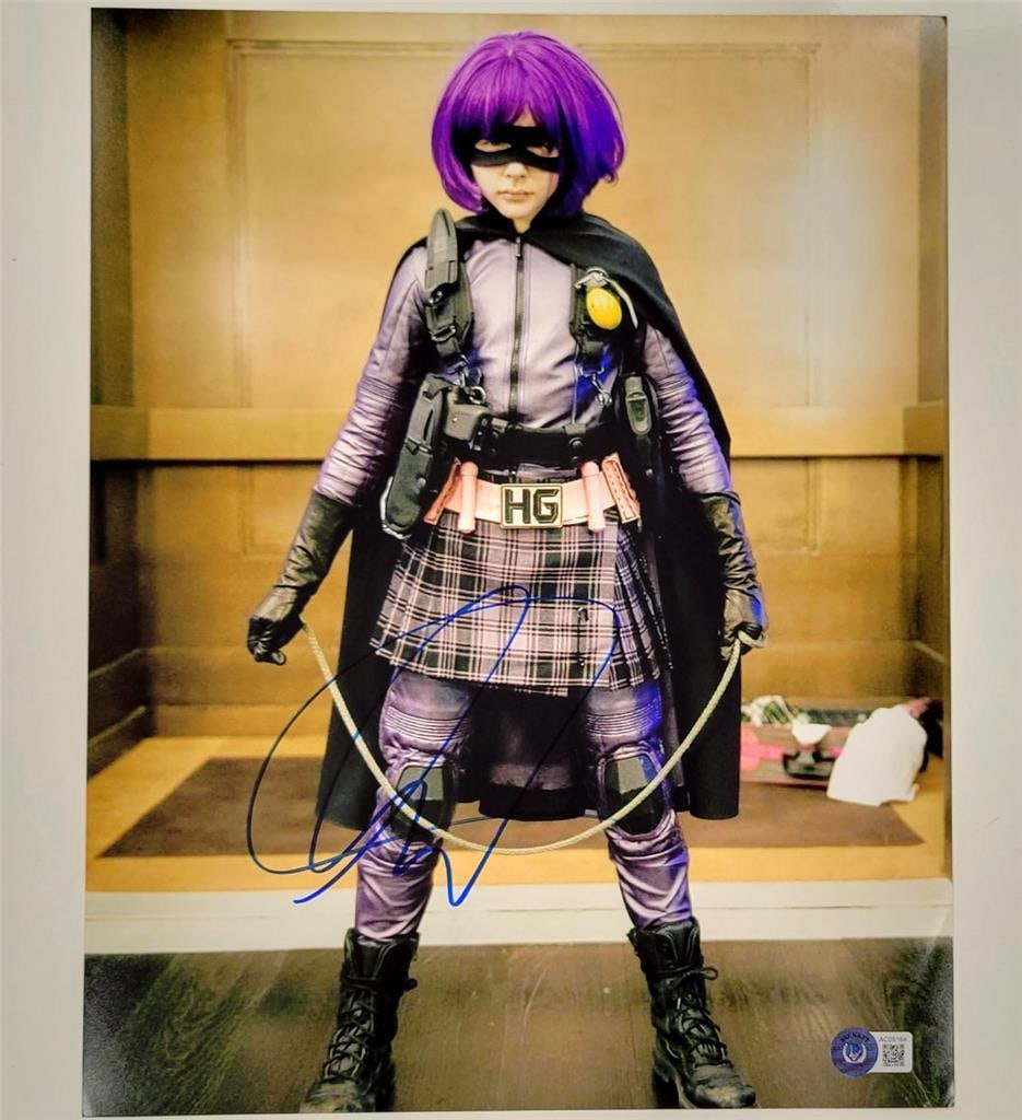 Chloe Moretz Signed Kick Ass 11x14 Photo Beckett Authenticated: Chloe Moretz Signed Kick Ass 11x14 Photo Beckett Authenticated This original 11x14 photograph features a striking image from the movie "Kick Ass," signed by the talented actress Chloe Moretz. The auto