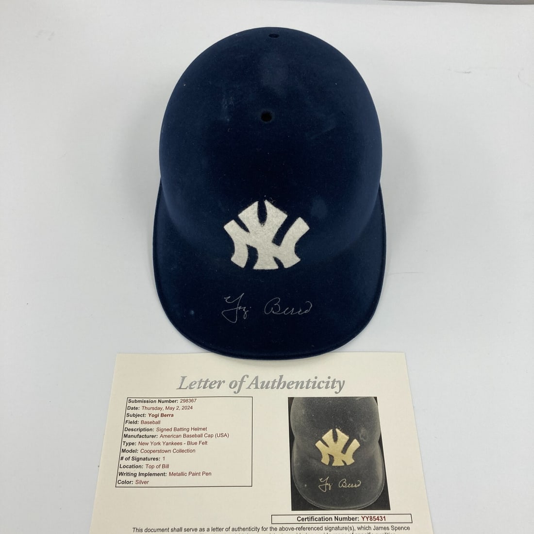 Yogi Berra Signed 1960s Yankees Helmet with JSA Authentication: Yogi Berra Signed 1960s Yankees Helmet with JSA Authentication This vintage-style New York Yankees baseball helmet is signed by the legendary Yogi Berra, a celebrated player in baseball history. The h