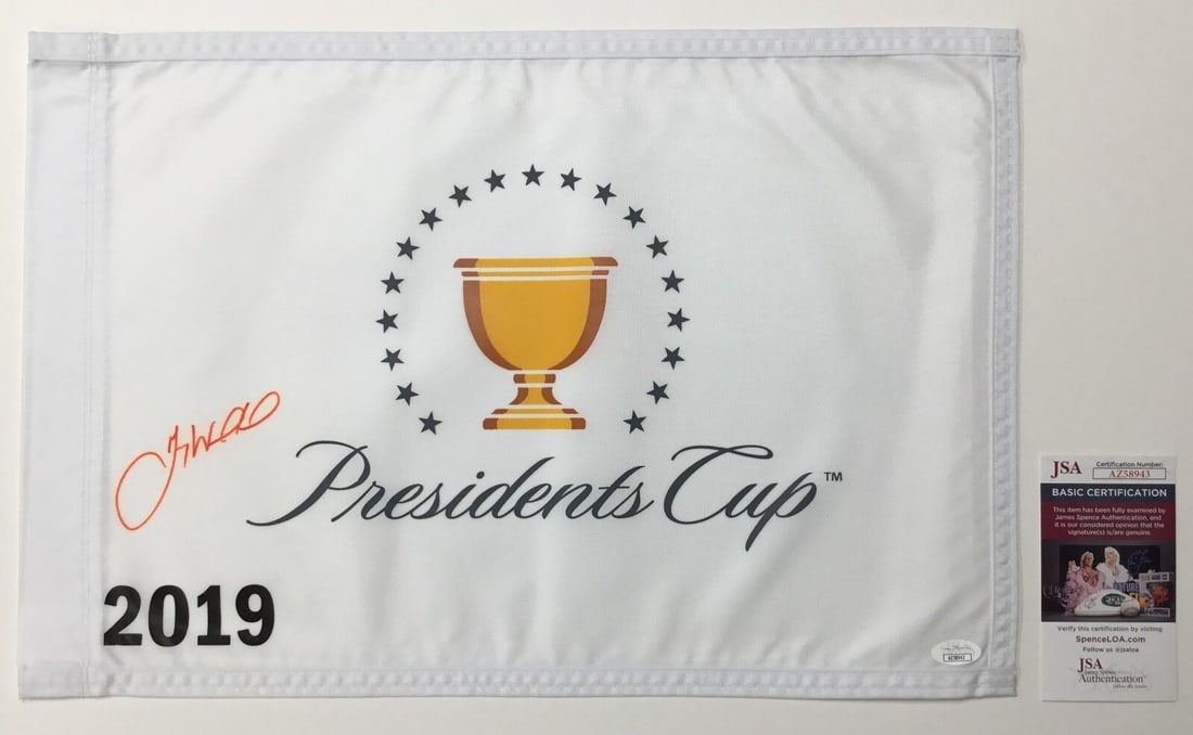 Gary Woodland Signed 2019 President's Cup Pin Flag JSA #AZ58943: Gary Woodland Signed 2019 President's Cup Pin Flag JSA #AZ58943 This is an officially licensed pin flag from The President's Cup 2019, personally signed by PGA star Gary Woodland. The autograph has be