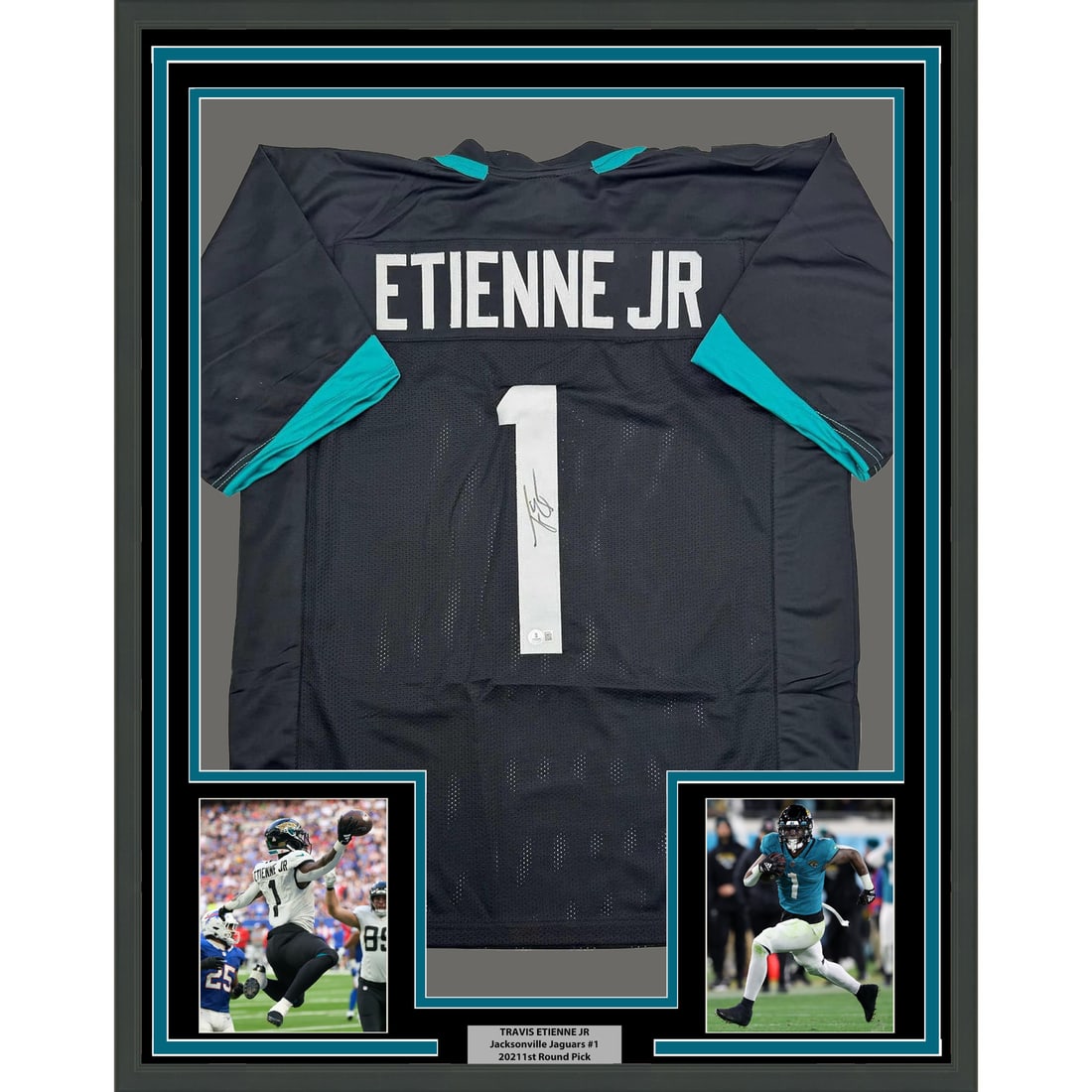 Framed Signed Travis Etienne Jr. Jersey with Beckett COA 35x39: Framed Signed Travis Etienne Jr. Jersey with Beckett COA 35x39 This professionally framed and autographed Travis Etienne Jr. jersey showcases the talented running back of the Jacksonville Jaguars. Mea