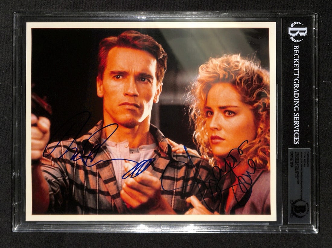 Total Recall 8x10 Photo Signed by Schwarzenegger and Stone Beckett 10: Total Recall 8x10 Photo Signed by Schwarzenegger and Stone Beckett 10 This stunning autographed 8x10 photo features iconic actors Arnold Schwarzenegger and Sharon Stone from the classic film "Total Re