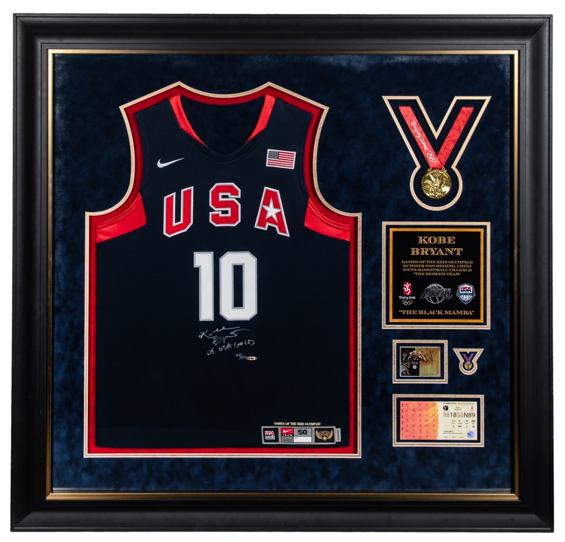Kobe Bryant Signed Team USA Jersey Limited Edition 37/50 UDA LOA: Kobe Bryant Signed Team USA Jersey Limited Edition 37/50 UDA LOA This limited-edition framed display features a signed Team USA Kobe Bryant basketball jersey, numbered 37 out of 50. The jersey, measur