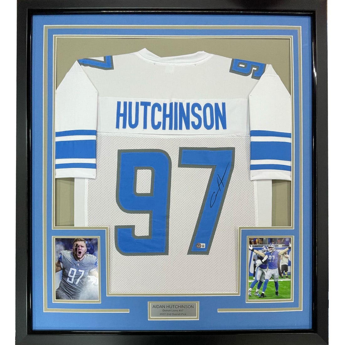 Framed Aidan Hutchinson Signed Jersey with Beckett COA Detroit Lions: Framed Aidan Hutchinson Signed Jersey with Beckett COA Detroit Lions This professionally framed display features an autographed Aidan Hutchinson white jersey, measuring 33x42 inches. The item includes