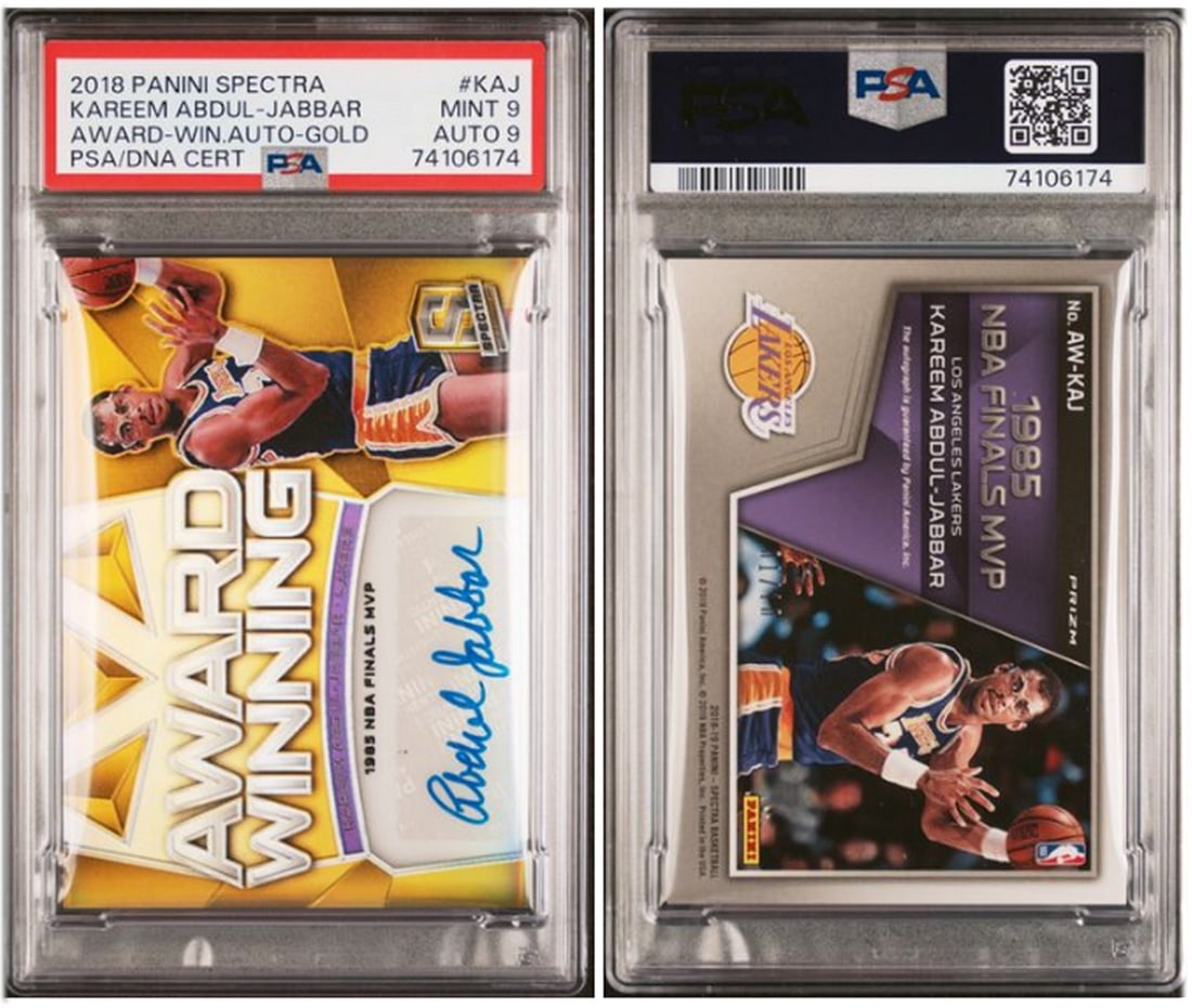 2018 Panini Spectra Kareem Abdul-Jabbar Gold Auto PSA 9 Serial Number 1 of 10: 2018 Panini Spectra Kareem Abdul-Jabbar Gold Auto PSA 9 Serial Number 1 of 10 This is a 2018 Panini Spectra Award-Winning Gold Auto trading card featuring Kareem Abdul Jabbar. The card has been profes