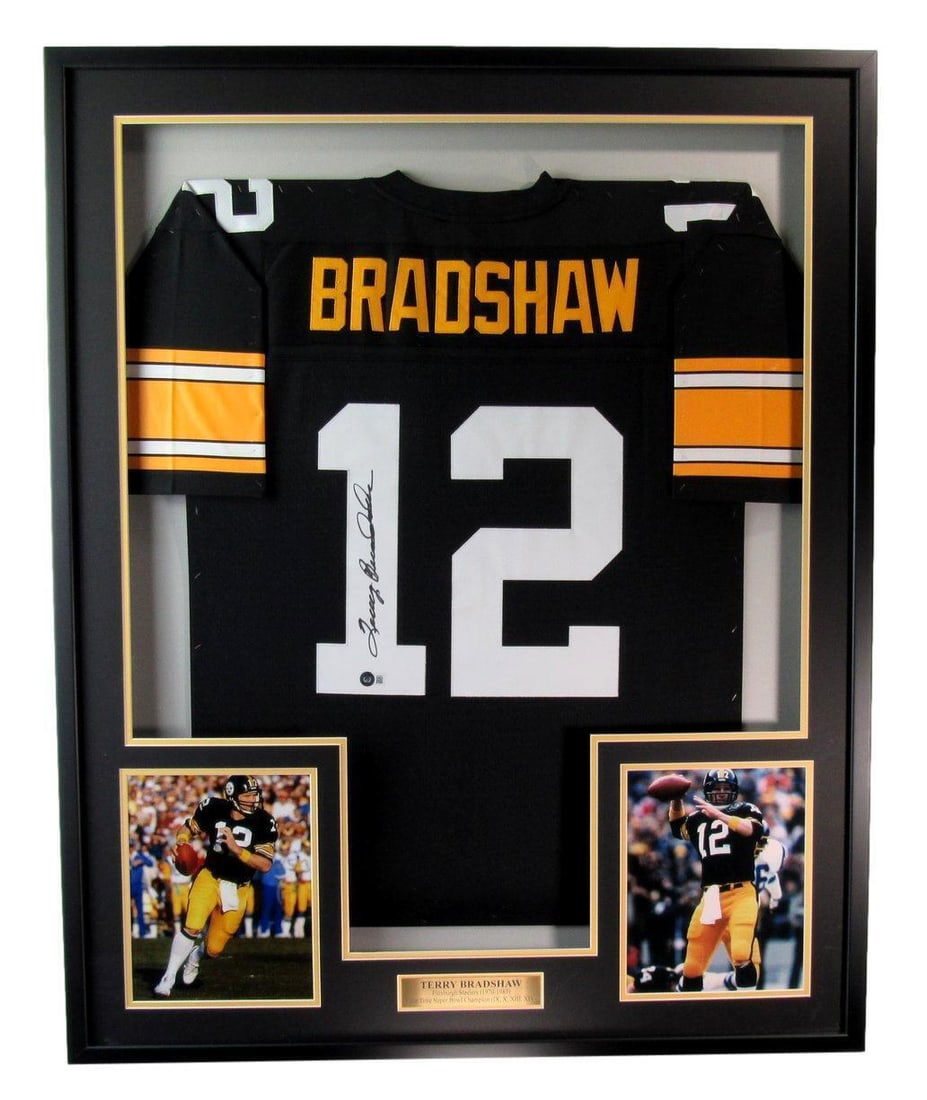 Framed Steelers Jersey Signed by Terry Bradshaw with Beckett Authentication: Framed Steelers Jersey Signed by Terry Bradshaw with Beckett Authentication This is a professionally framed Terry Bradshaw autographed Mitchell & Ness Pittsburgh Steelers football jersey, authenticate