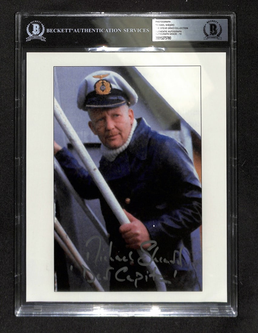 Michael Sheard Signed Indiana Jones 8x10 Photo Beckett Graded 10 Autograph: Michael Sheard Signed Indiana Jones 8x10 Photo Beckett Graded 10 Autograph This is an original 8x10 color photograph signed in silver permanent marker by Michael Sheard, who portrayed submarine Captai