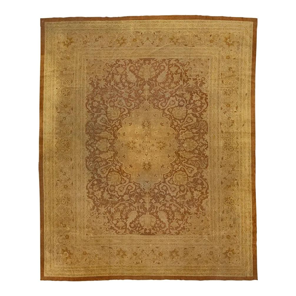 Handmade Amritsar Brown Wool Rug with Floral Medallion 12' x 14'7: Handmade Amritsar Brown Wool Rug with Floral Medallion 12' x 14'7 This exquisite hand-knotted Amritsar wool rug showcases a rich brown background adorned with elegant tan floral medallions. The design