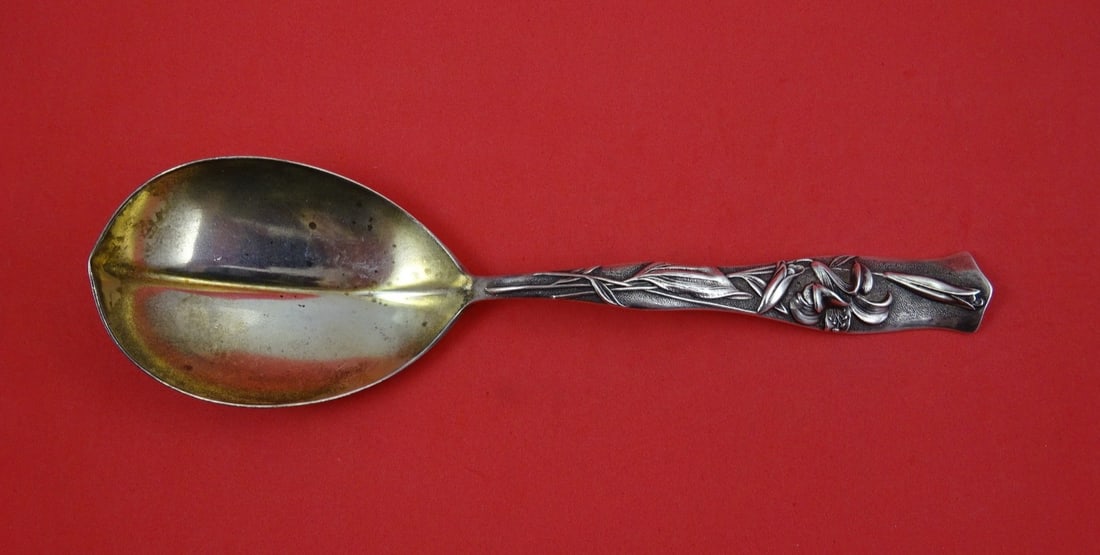 Sterling Silver Berry Spoon Flora Pattern with Garden Lily by Shiebler 8.5 Inch: Sterling Silver Berry Spoon Flora Pattern with Garden Lily by Shiebler 8.5 Inch This is a Shiebler sterling silver berry spoon in the Flora pattern, featuring a pointed bowl with a garden lily motif. 
