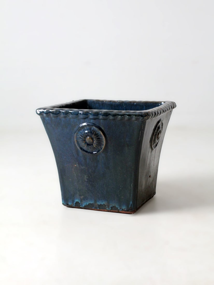 Blue Art Deco Pottery Planter with Rosette Relief Design: Blue Art Deco Pottery Planter with Rosette Relief Design This vintage American Art Deco planter features a flared geometric design with rosette relief detailing and a richly saturated blue glaze. Its 