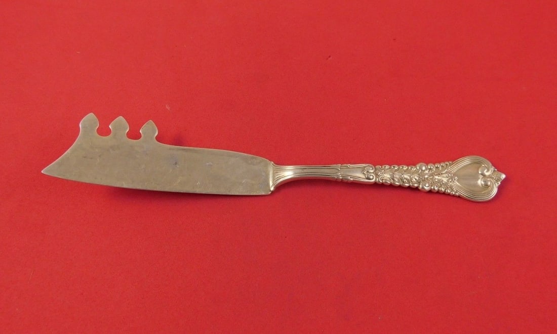 Tiffany & Co Florentine Sterling Silver Cheese Knife with Pick 7 1/8": Tiffany & Co Florentine Sterling Silver Cheese Knife with Pick 7 1/8" This exquisite cheese knife from the Florentine pattern by Tiffany & Co. is crafted from high-quality sterling silver. Measuring 7
