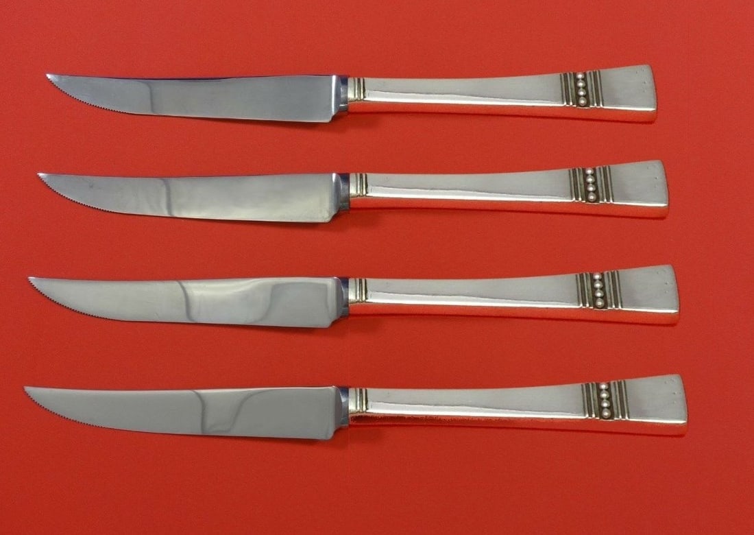 Reed and Barton Diadem Sterling Silver Steak Knife Set 4pc Custom Made: Reed and Barton Diadem Sterling Silver Steak Knife Set 4pc Custom Made This exquisite 4-piece steak knife set, crafted by Reed & Barton, features the elegant Diadem pattern. Made of high-quality sterl