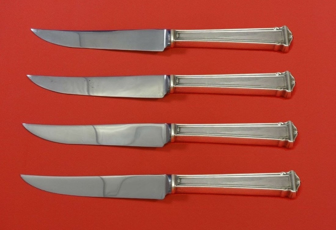 Theseum International Sterling Silver 4pc Steak Knife Set 8.5": Theseum International Sterling Silver 4pc Steak Knife Set 8.5" Elevate your dining experience with this exquisite 4-piece steak knife set from the Theseum pattern by International Sterling. Crafted fr