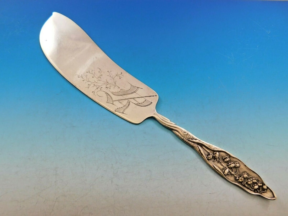 Whiting Sterling Silver Ice Cream Slice 12.5" Lily of the Valley Pattern: Whiting Sterling Silver Ice Cream Slice 12.5" Lily of the Valley Pattern Discover the elegance of this Whiting Sterling Silver Ice Cream Slice, featuring a beautiful Lily of the Valley pattern. Measur