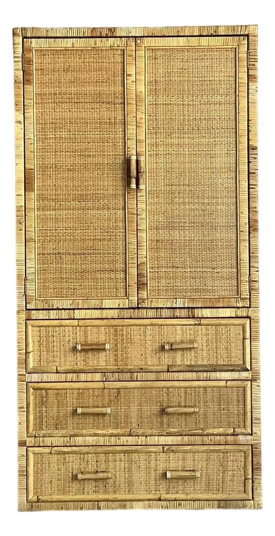 Boho Chic Rattan and Bamboo Armoire With Double Doors and Three Drawers: Boho Chic Rattan and Bamboo Armoire With Double Doors and Three Drawers This vintage armoire is expertly crafted from woven rattan and bamboo, showcasing a textured surface in a warm tan hue and a dis