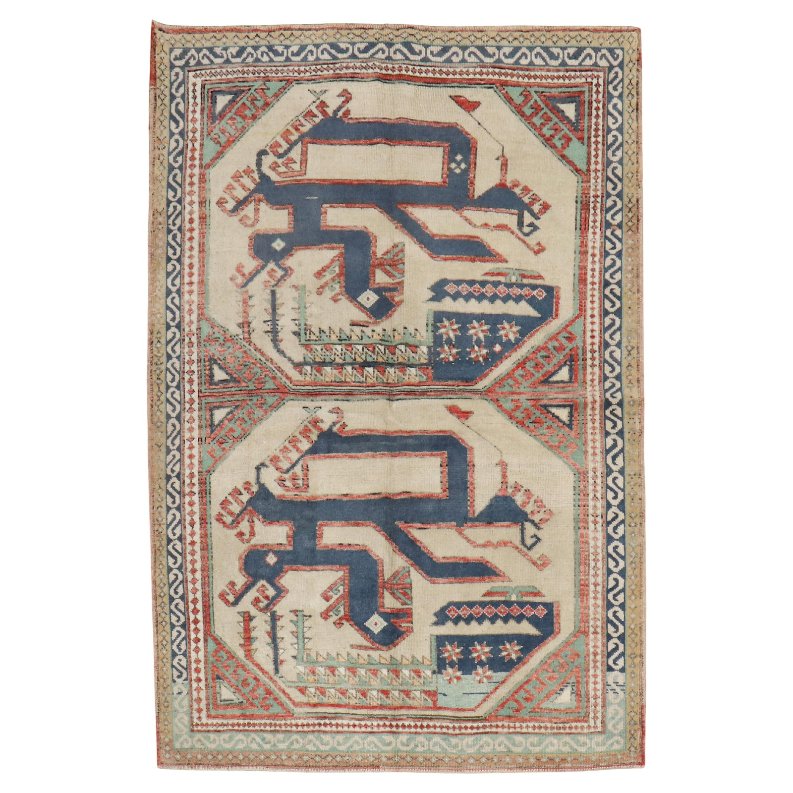 Mid 20th Century Turkish Wool Slithering Snake Rug 4'3 x 6': Mid 20th Century Turkish Wool Slithering Snake Rug 4'3 x 6' This stunning mid-20th century Turkish rug features a striking design of two slithering snakes set against an elegant ivory field. The rug i