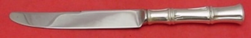 Tiffany & Co Bamboo Sterling Silver Dinner Knife 9 3/8 Inch: Tiffany & Co Bamboo Sterling Silver Dinner Knife 9 3/8 Inch This elegant dinner knife from the Bamboo pattern by Tiffany & Co. features a sterling silver hollow handle complemented by a stainless stee