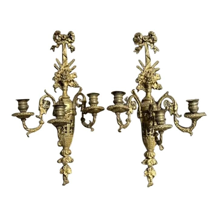 Pair of Vintage Regency Gilt Candle Sconces with Elegant Detailing: Pair of Vintage Regency Gilt Candle Sconces with Elegant Detailing Enhance your decor with this stunning pair of Vintage Regency Gilt Candle Sconces. Showcasing intricate gilt detailing and a luxuriou