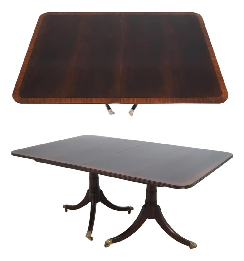 Mahogany Dining Table with Double Pedestal and Brass Paw Feet by Stickley: Mahogany Dining Table with Double Pedestal and Brass Paw Feet by Stickley This Stickley Regency style dining table features a double pedestal design with Duncan Phyfe pedestals and a beautifully figur